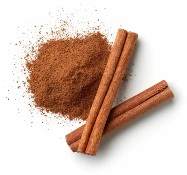 Three Cinnamon sticks and a pile of ground Cinnamon are displayed on a white background.