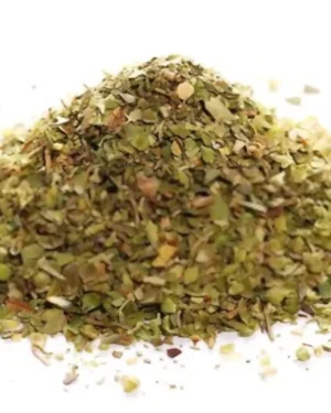 A pile of dried Oregano, finely chopped, is placed on a white background. The green and brown leaves are loosely scattered, showcasing their texture and colors—an excellent sample from our bulk supplier specializing in Egyptian Oregano.