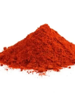 A small mound of finely ground, bright red-orange powder labeled "Paprika" is centered on a white background. The powder appears slightly textured and resembles a culinary spice, with some particles scattered around the base of the mound, creating a tempting sight for B2B Paprika suppliers.