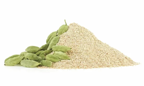 A pile of ground organic cardamom from Cardamom is next to a bunch of whole green pods. The finely ground spice forms a small mound, highlighting the contrast between the powdery texture and the smooth, oval-shaped pods. The white background emphasizes why so many choose to buy Cardamom for their kitchens.