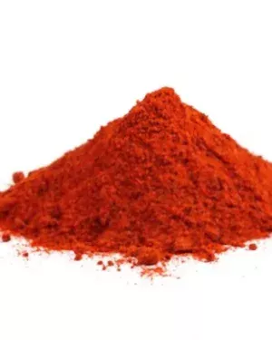 A small mound of finely ground, bright red-orange powder labeled "Paprika" is centered on a white background. The powder appears slightly textured and resembles a culinary spice, with some particles scattered around the base of the mound, creating a tempting sight for B2B Paprika suppliers.