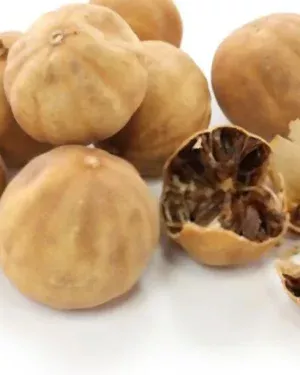 A cluster of Lemon dried, with a few split open to reveal their desiccated interiors. The lemons, featuring a beige and wrinkled outer skin, are arranged on a white background.